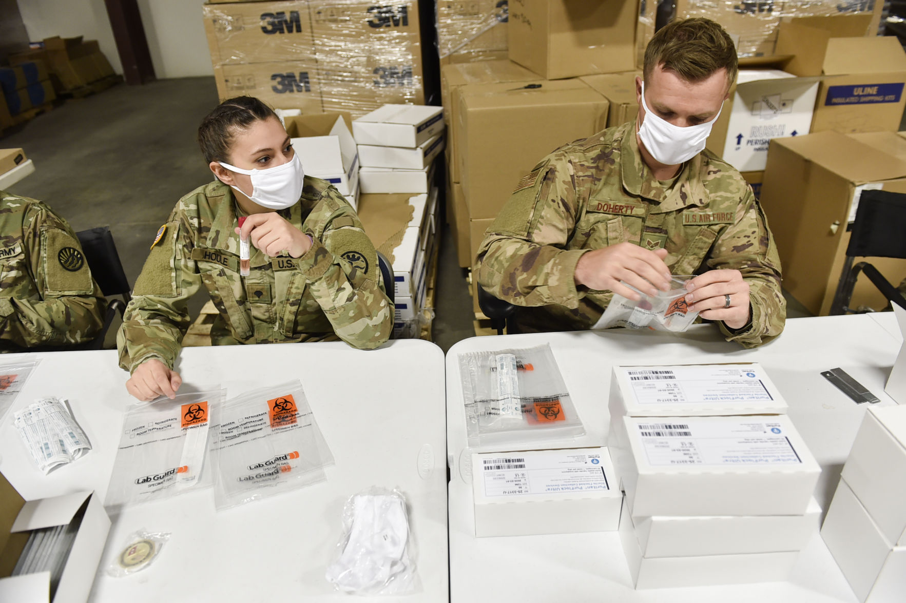 Soldiers from the Montana National Guard assemble COVID-19 testing kits